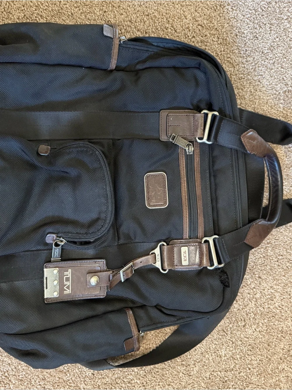 Tumi Black Backpack with Brown Leather Accents